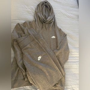Dark grey Nike sweat suit.